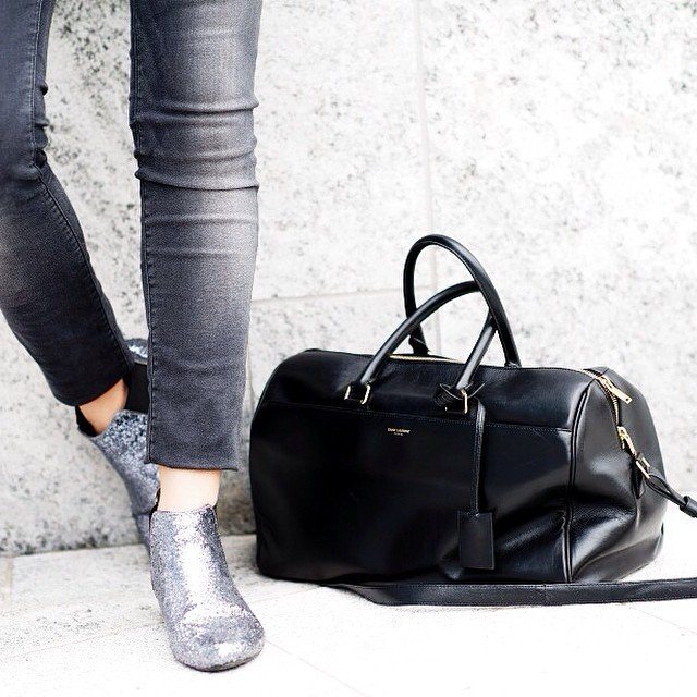 Flaunt the Italian style of black leather on your outdoor trips with this Classic 12 Hour Duffel by Saint Laurent.