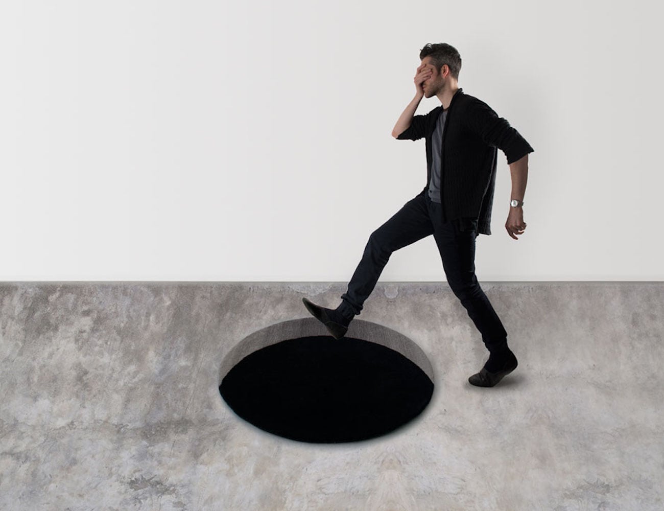 Round Void Wool Floor Rug creates the illusion of a black hole