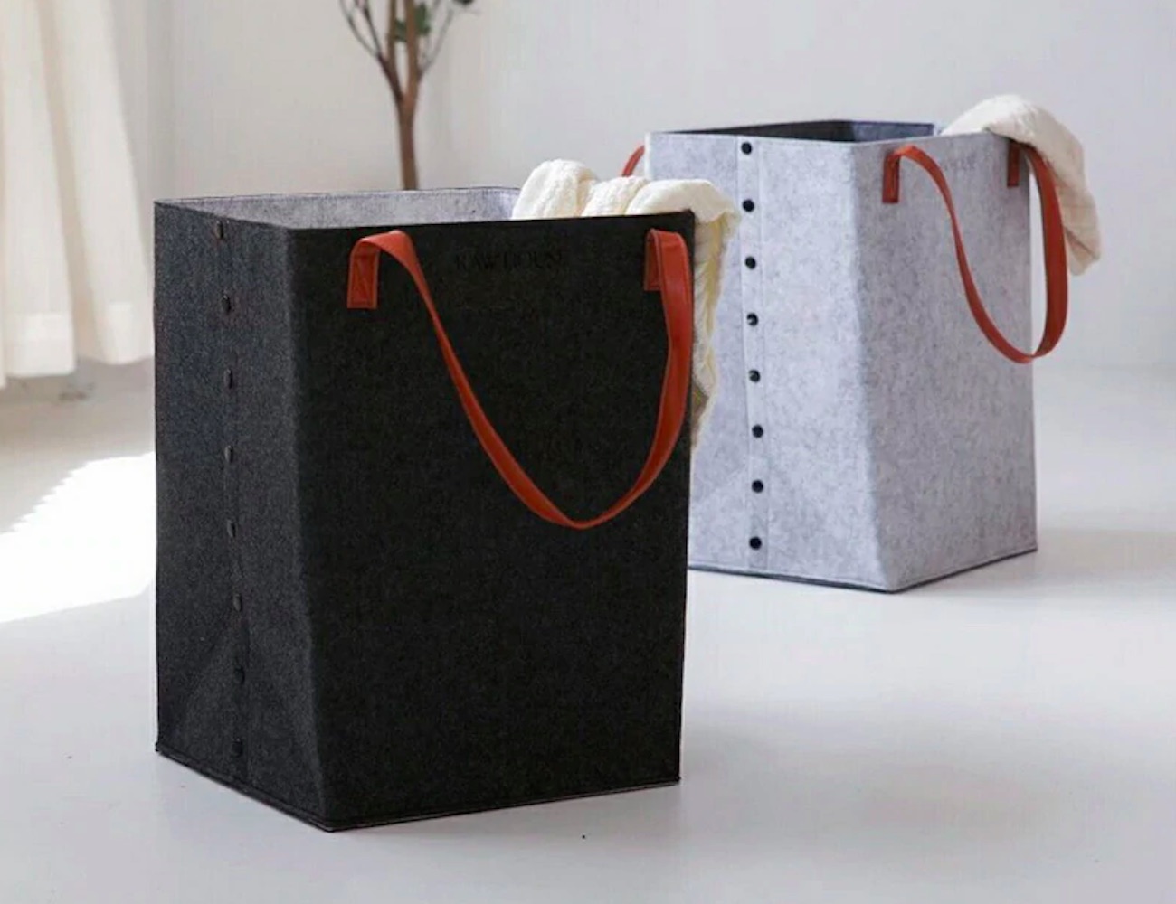 This bucketstyle laundry basket is loaded with style