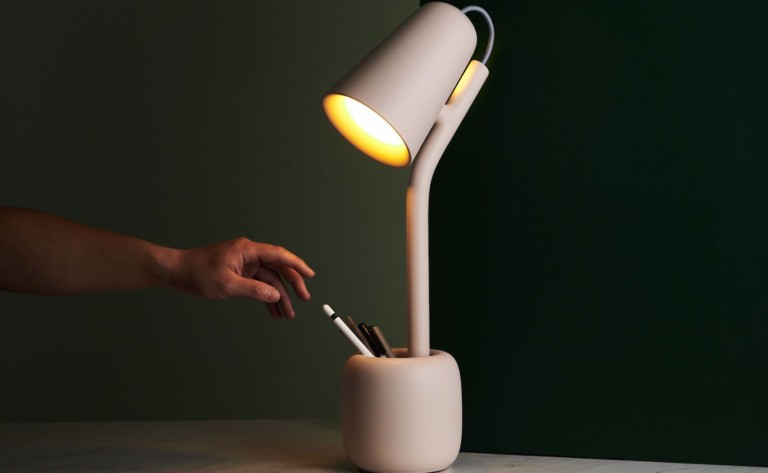 Suyo Table Light Utilitarian Lamp helps reduce clutter on your desk