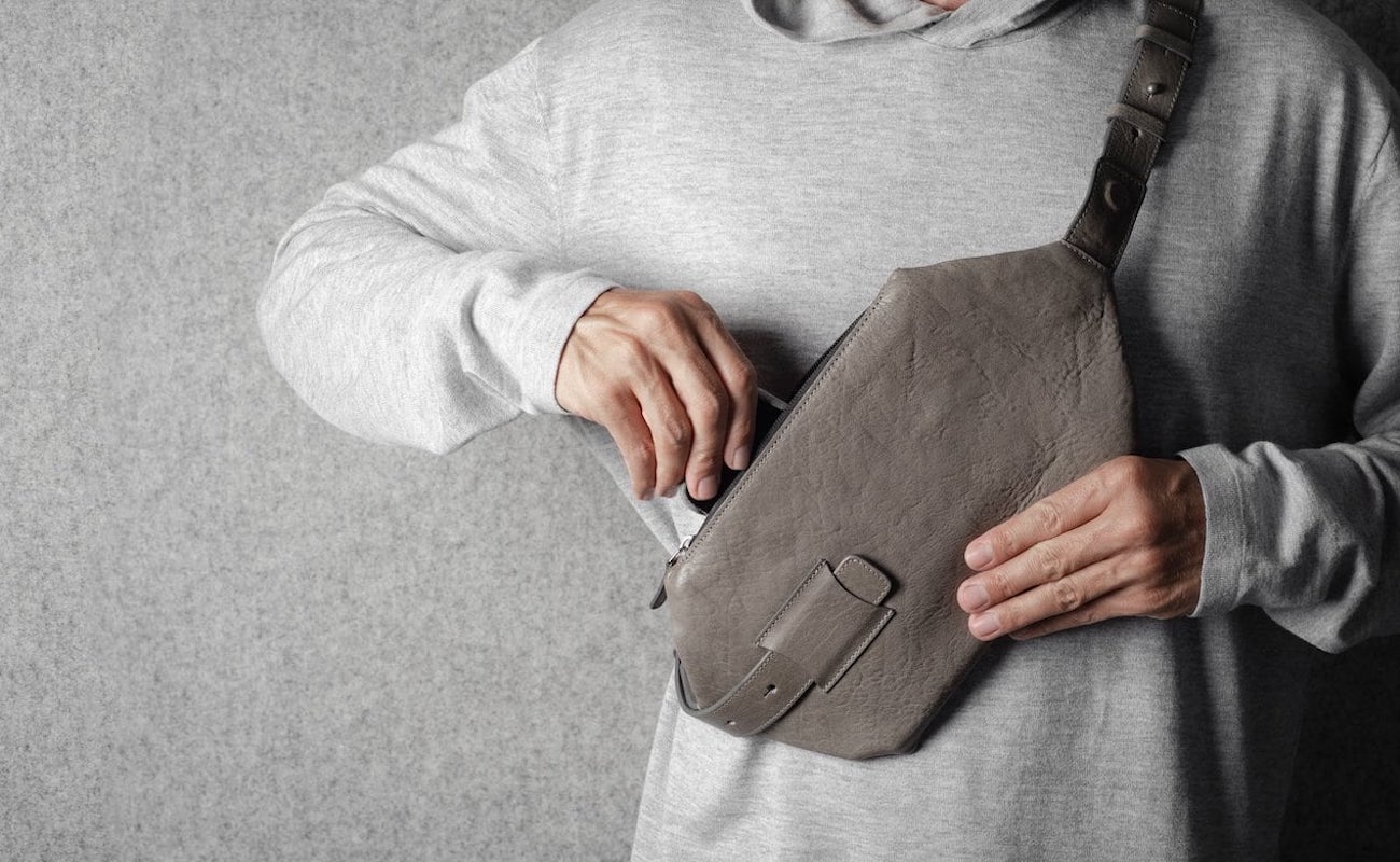 Person wearing the Cross-Body Bag in Off-Grey