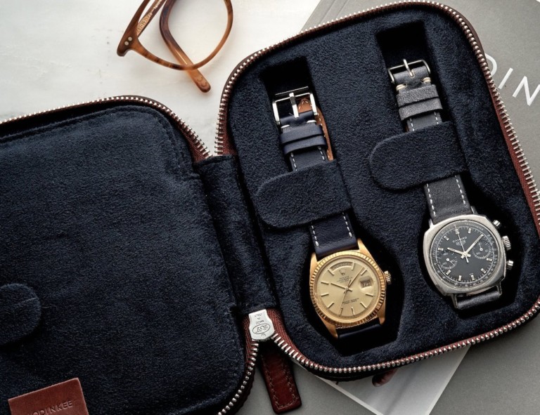 Open watch travel case with two watches inside