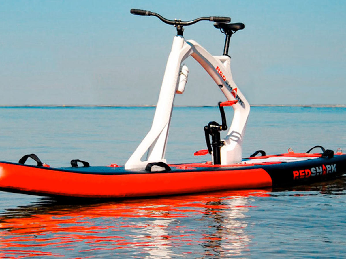 Red Shark Bikes Enjoy Inflatable Stand-up Paddleboard comes with pedals for movement