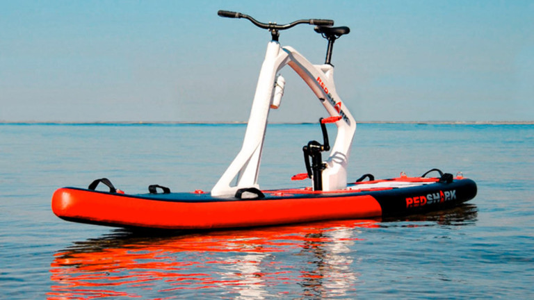 Red Shark Bikes Enjoy Inflatable Stand-up Paddleboard comes with pedals for movement