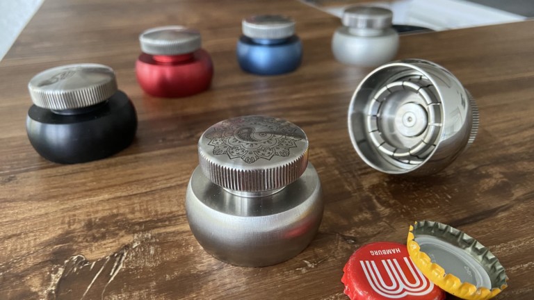 Cap-Extractor bottle opener lets you reuse the cap after opening a drink