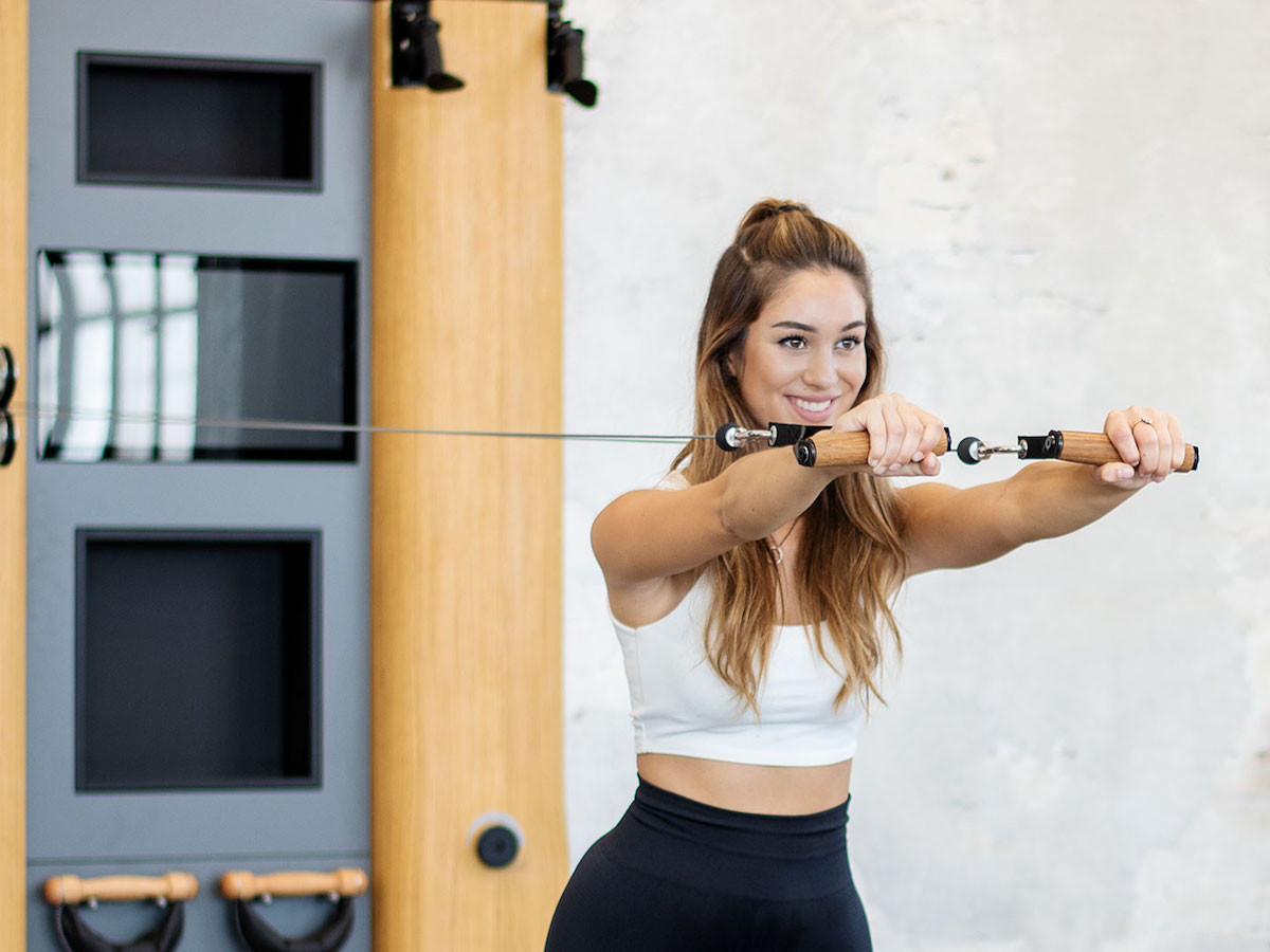 NOHrD Wall Compact all-in-one exercise wall features free weights and a virtual coach