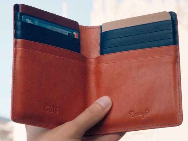 Danny P. Leather Passport Wallet has a passport slot, space for notes, & credit card slots