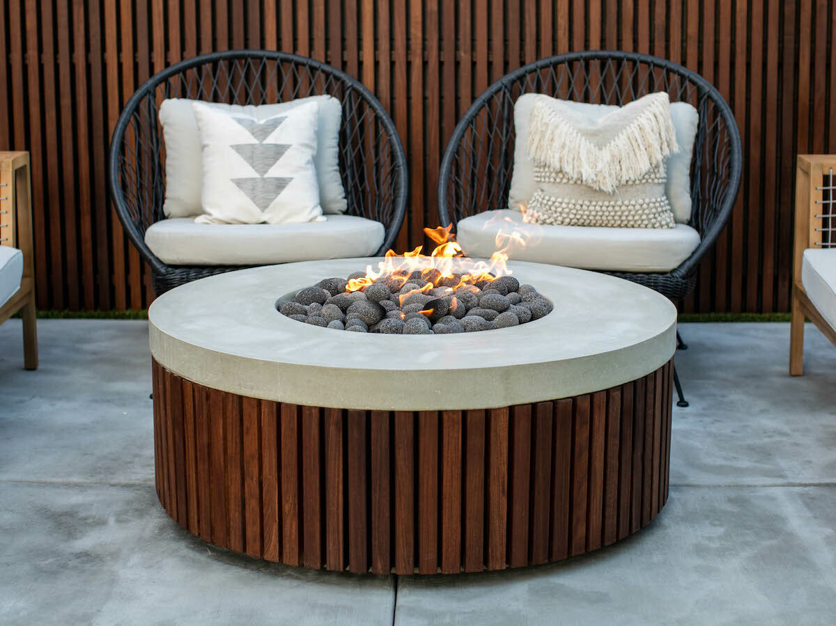 San Clemente outdoor fire table features a handcrafted pewter finish and provides warmth