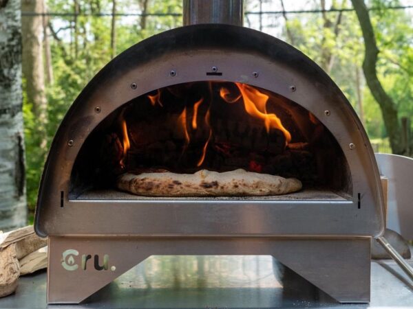 Cru Oven Model 30 portable pizza oven allows you to make wood-fired pizza anywhere