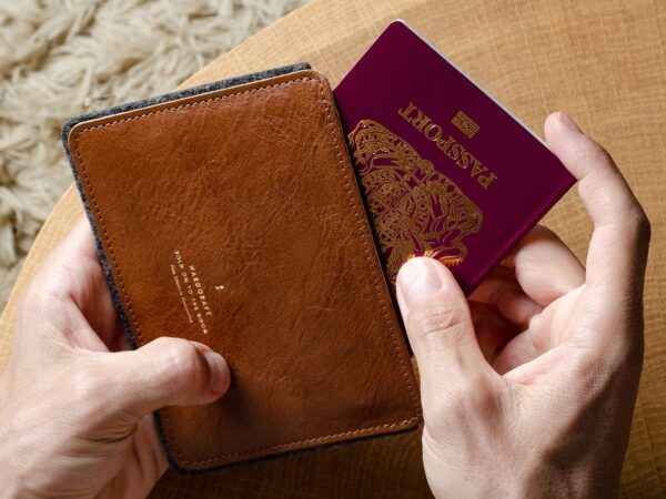 hardgraft Fast Track Passport Wallet holds 2 passports, 2 credit cards, and flight tickets