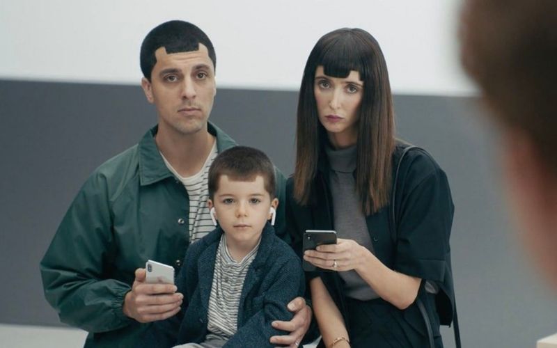 Samsung ad with people whose haircuts looked like Apple notches