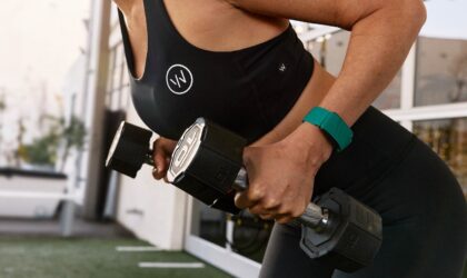 WHOOP 5.0 on a woman with dumbells