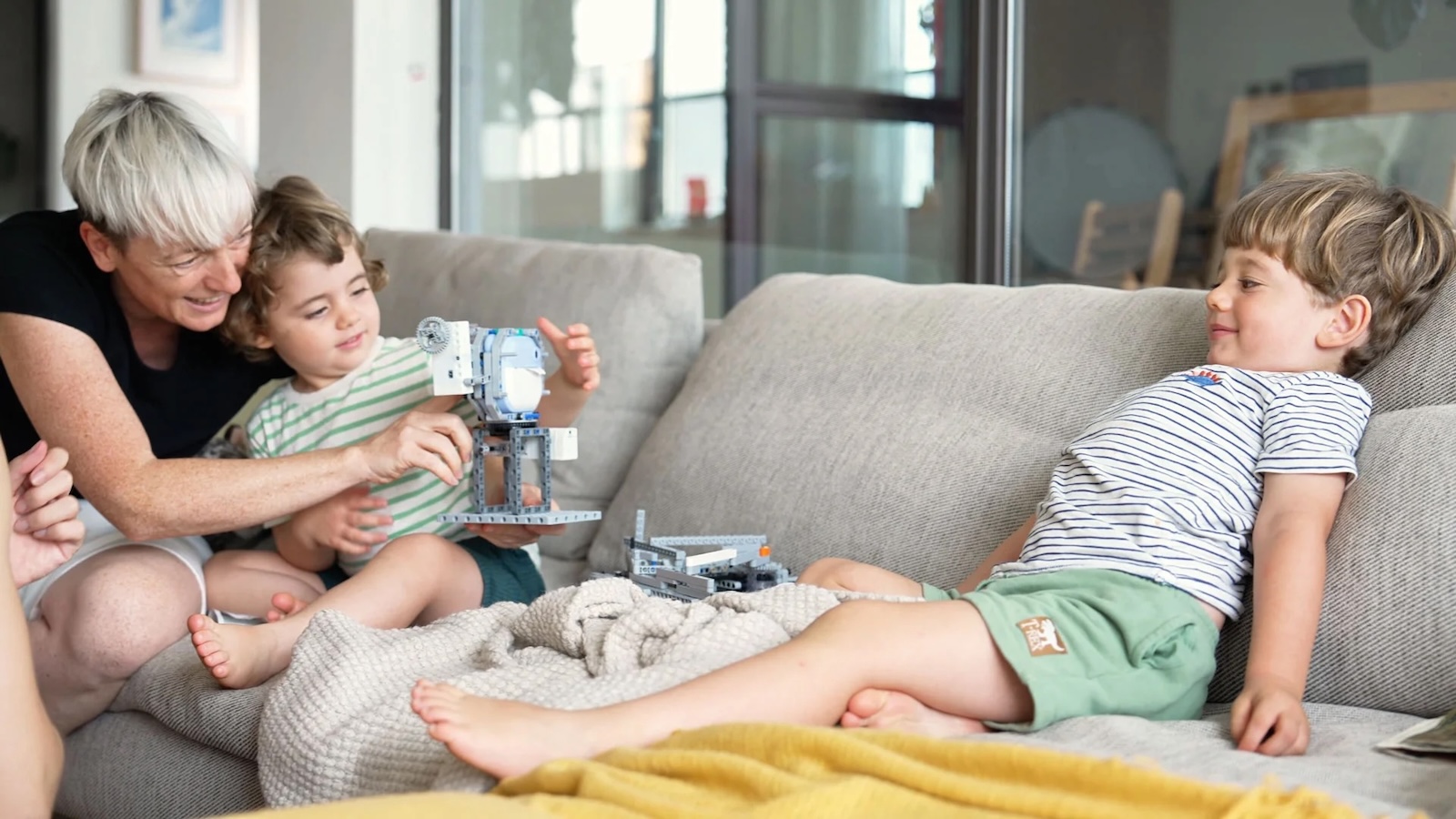 Kids building different robot models with magnetic blocks